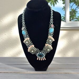 Elegant Silver Necklace with Pink and Blue Details